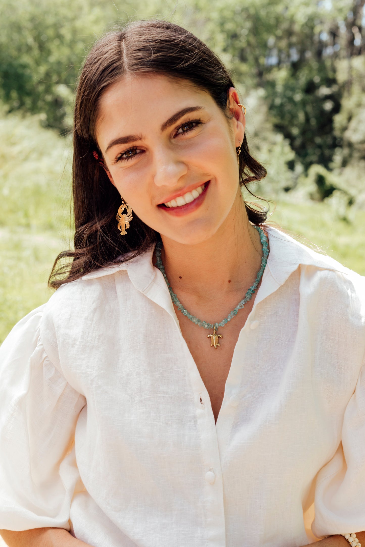 Pwani Necklace with Aqua stones:: Assorted Charms